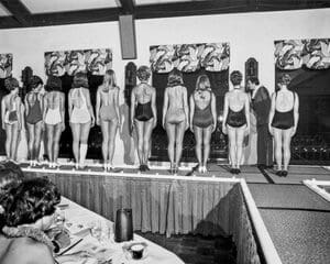 Women facing away on stage of Beauty Pageant